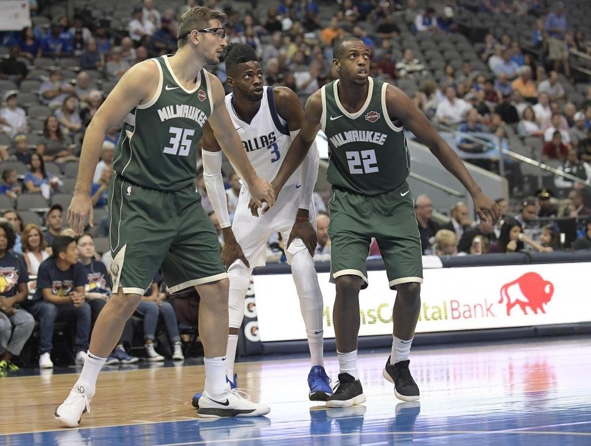 Milwaukee Bucks forward Mirza Teletovic (35) and forward Khris Middleton (22) guard Dallas Mavericks forward Nerlens Noel (3) as the Dallas Mavericks play the Milwaukee Bucks in preseason NBA game Bucks at American Airline Center in Dallas on Oct. 2, 2017.