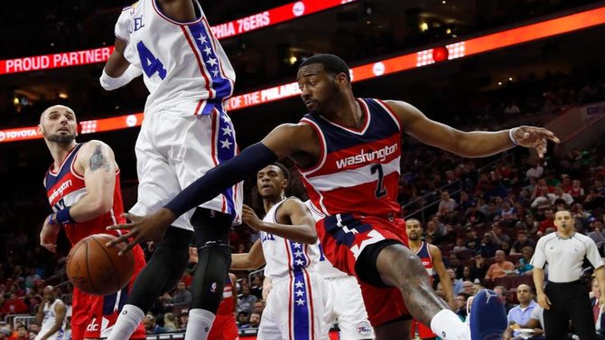 The Wizards’ John Wall passed around the 76ers’ Nerlens Noel during Thursday’s game in Philadelphia.