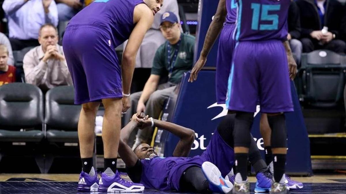 Michael Kidd-Gilchrist grimaced on the floor at Bankers Life Fieldhouse in Indianapolis on Wednesday after injuring his right shoulder.