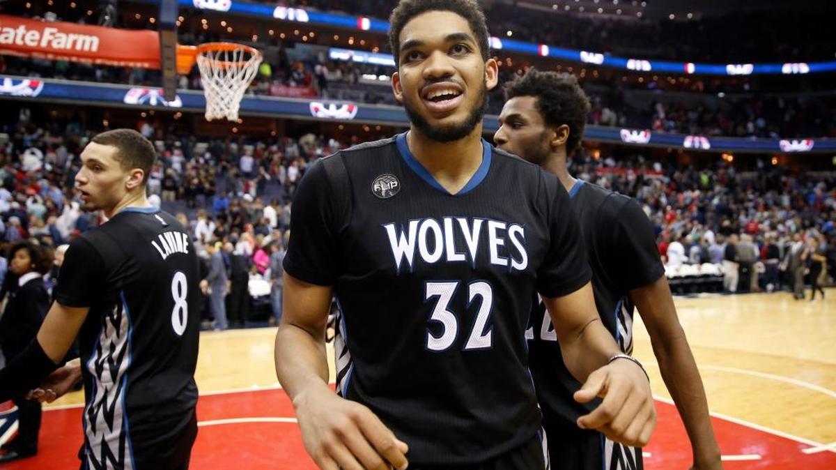 Minnesota Timberwolves center Karl-Anthony Towns celebrates after an NBA basketball game against the Washington Wizards, Friday, March 25, 2016, in Washington. The Timberwolves won 132-129 in double overtime.