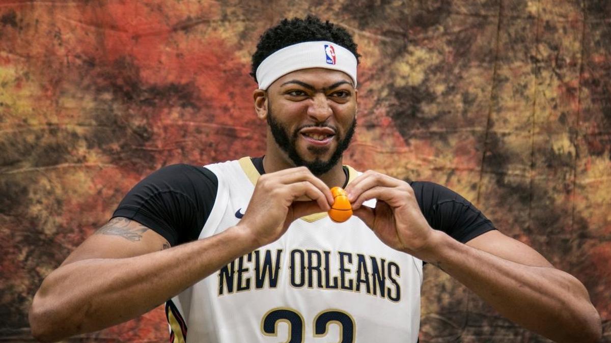 New Orleans Pelicans Anthony Davis goofs off with a tiny basketball at the Smoothie King Center in New Orleans during the NBA basketball team’s media day, Monday, Sept. 25, 2017, in New Orleans.