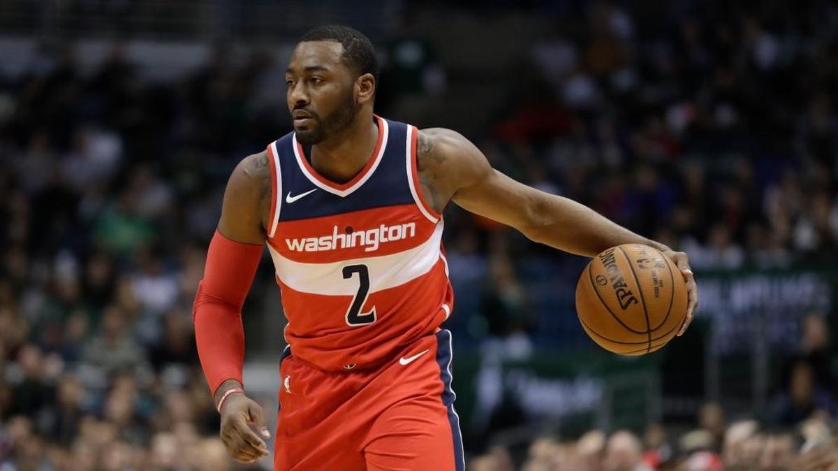 The Washington Wizards’ John Wall dribbled the ball during the first half against the Milwaukee Bucks on Nov. 20.