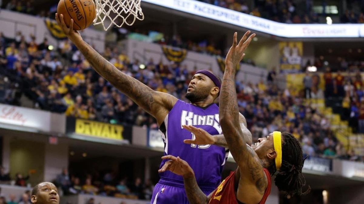 Sacramento Kings forward DeMarcus Cousins (15) took a shot in front of Indiana Pacers center Jordan Hill, right, during the first half of an NBA basketball game in Indianapolis, Wednesday, Dec. 23, 2015.