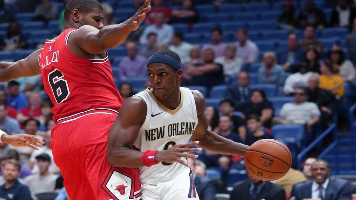 New Orleans Pelicans guard Rajon Rondo drives the lane against Chicago Bulls forward Cristiano Felicio (6) in the second half of an NBA preseason basketball game in New Orleans, Tuesday, Oct. 3, 2017.