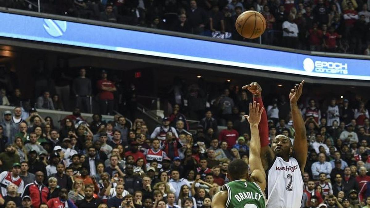 Wizards guard John Wall (2) shoots the game-winning three-pointer over Celtics guard Avery Bradley during the final seconds of Game 6.
