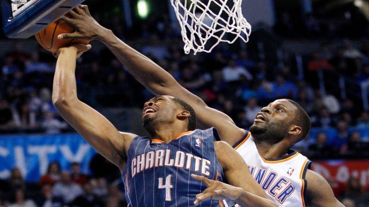 Oklahoma City Thunder center Nazr Mohammed, right, blocked a shot by Charlotte Bobcats forward Derrick Brown (4) during the second quarter on March 10, 2012.