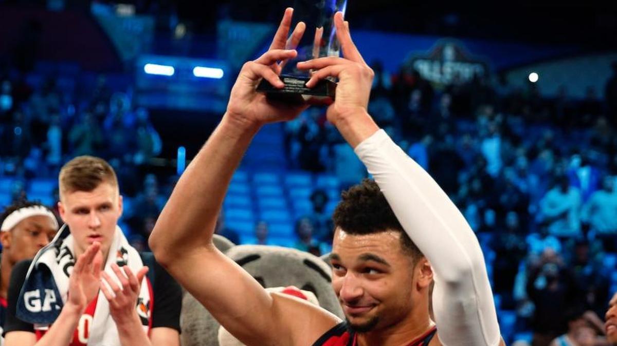 World guard Jamal Murray (27) of the Denver Nuggets holds up his MVP trophy after the Rising Stars Challenge, part of NBA All-Star events in New Orleans, Friday, Feb. 17, 2017.