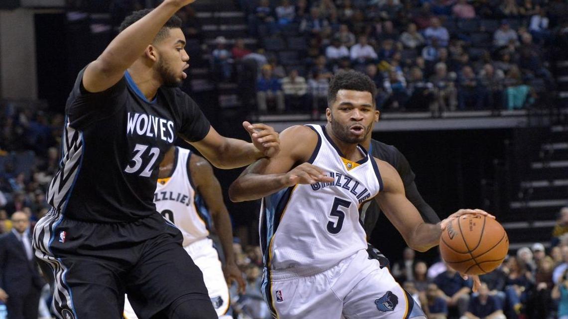 Memphis Grizzlies guard Andrew Harrison (5) drove against Minnesota Timberwolves center Karl-Anthony Towns (32) in the second half on Saturday, Nov. 19, 2016, in Memphis.