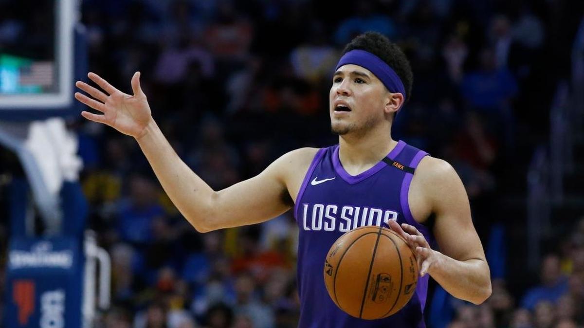 Devin Booker averaged 24.9 points and 4.7 assists per game this season, but his Phoenix Suns finished last in the Western Conference with a record of 21-61.