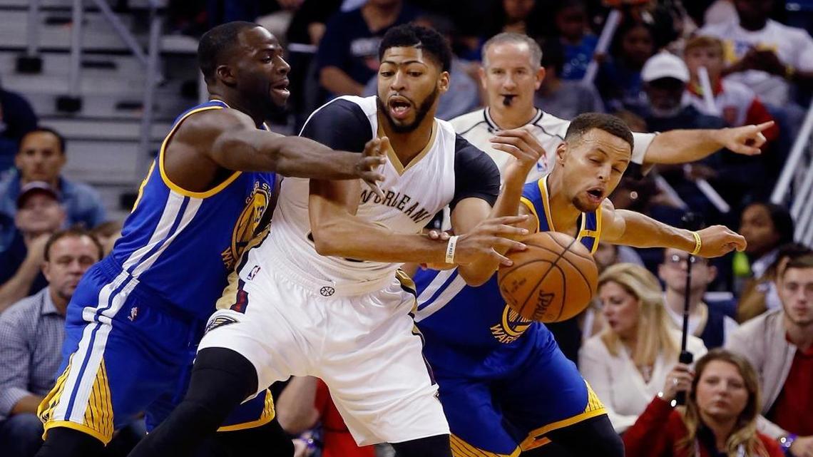 New Orleans Pelicans forward Anthony Davis (23) is fouled by Golden State Warriors guard Stephen Curry (30) right, with support from forward Draymond Green (23) during the first half of an NBA basketball game in New Orleans, La., Friday, Oct. 28, 2016.