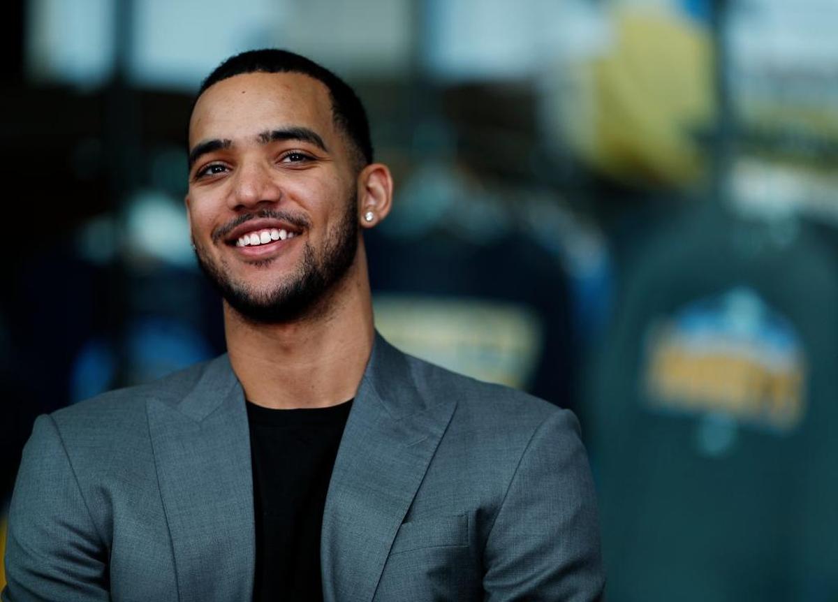 Denver Nuggets forward Trey Lyles, acquired in a draft-day trade with the Utah Jazz, jokes with reporters during an NBA basketball news conference in Denver, Tuesday, June 27, 2017.