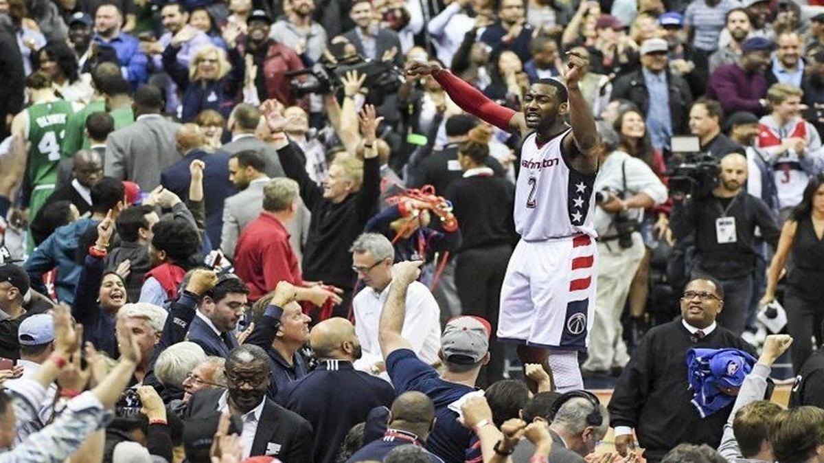 John Wall celebrated his game-winning three-pointer in Game 6 with fans at Verizon Center in Washington.