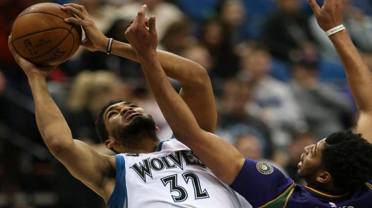 Timberwolves center Karl-Anthony Towns was fouled by Pelicans forward Anthony Davis as he took a shot during the third quarter on Feb. 8 at the Target Center in Minneapolis.