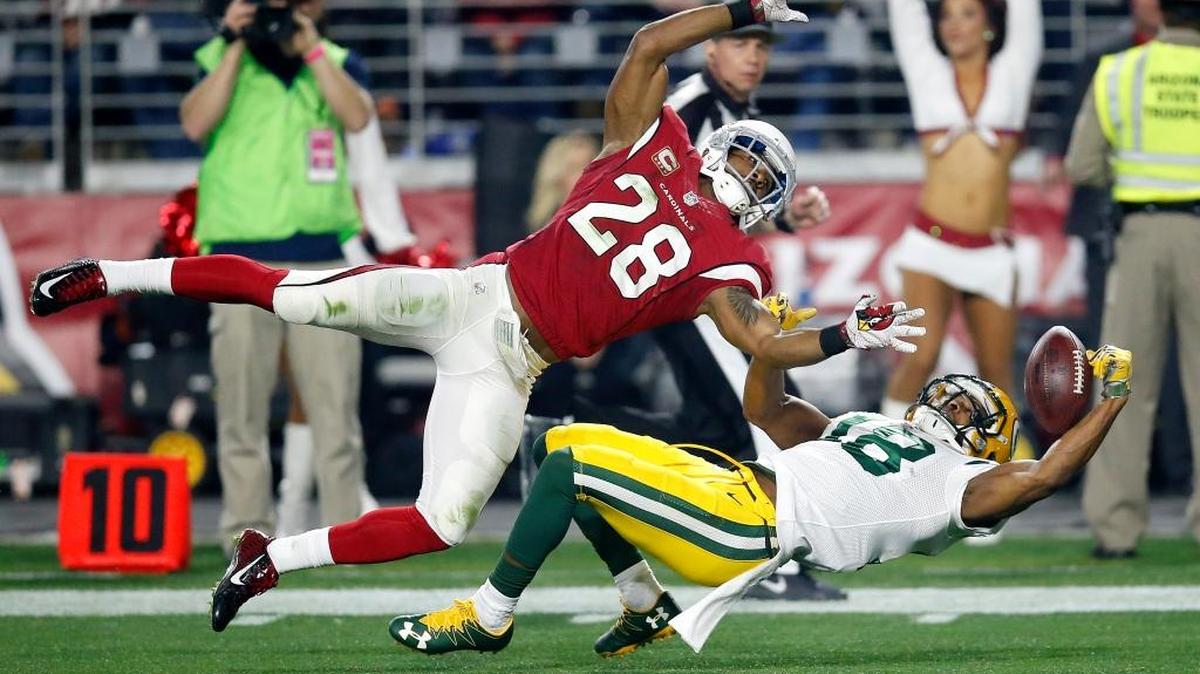 Packers wide receiver Randall Cobb (18) made a spectacular one-handed catch against Cardinals cornerback Justin Bethel, but it was negated by offsetting penalties. Cobb was injured on the play.