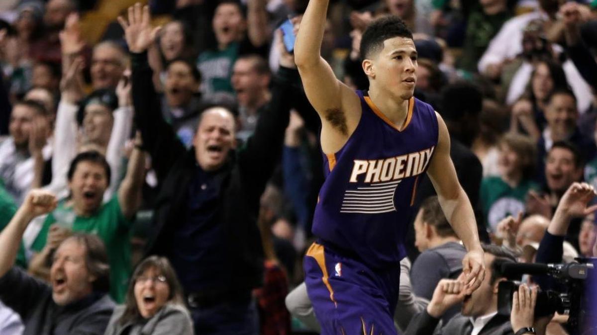 Phoenix Suns guard Devin Booker was cheered by Boston Celtics fans in the fourth quarter of Friday’s game as he became just the sixth player in NBA history to score 70 or more points in a game.