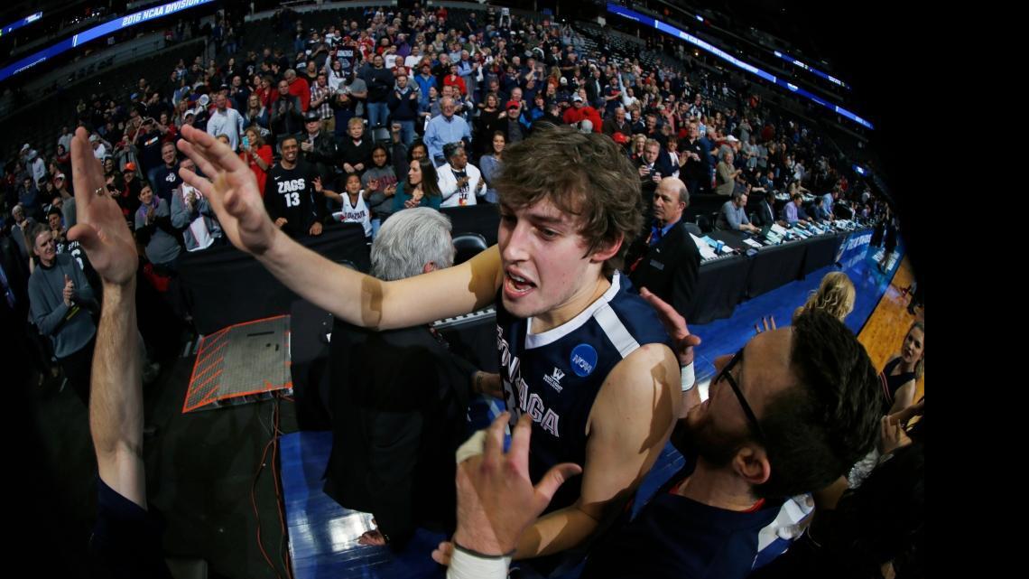 Gonzaga forward Kyle Wiltjer is congratulated as he leaves the court after Gonzaga defeated Utah 82-59 Saturday, March 19, 2016, in the second round of the NCAA men's college basketball tournament in Denver.