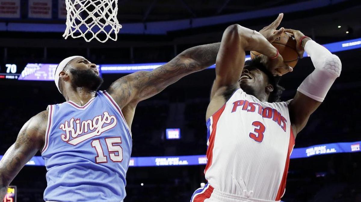 Sacramento Kings center DeMarcus Cousins (15) pressures Detroit Pistons forward Stanley Johnson (3) before Johnson makes the basket during the second half of an NBA basketball game, Friday, March 18, 2016, in Auburn Hills, Mich. The Pistons defeated the Kings 115-108.