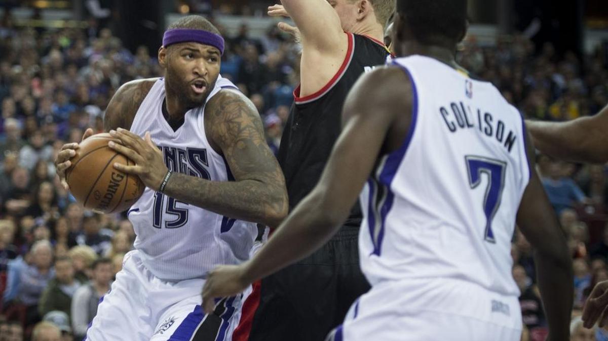 Kings forward DeMarcus Cousins (15) looked to make a pass against the Portland Trail Blazers on Sunday, Dec. 27, 2015.