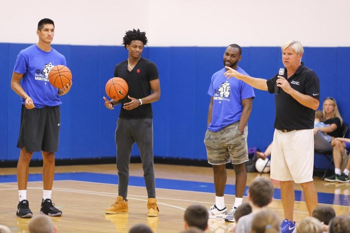 UK Basketball assistant coach John Robin introduces former UK Basketball players (left to right) Derek Willis, De'Aaron Fox and Dominique Hawkins as they take part in the 2017 John Calipari UK Pro Camps at the Joe Craft Center in Lexington, Ky., on Tuesday, August 1, 2017.