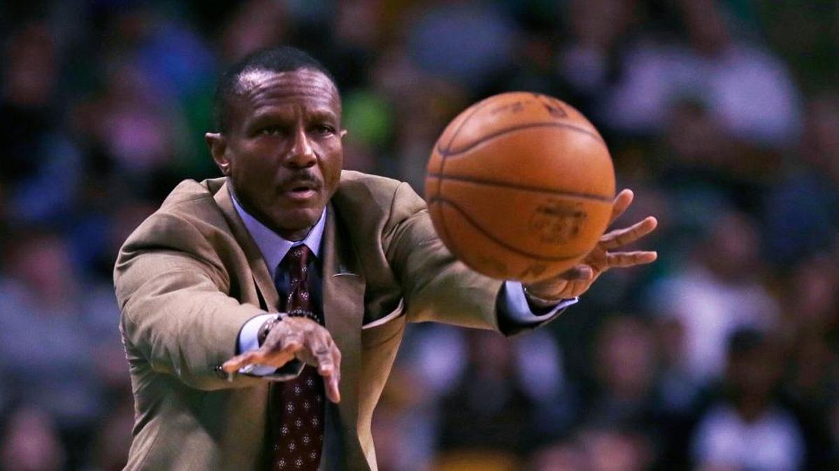 Toronto Raptors Coach Dwane Casey passed the ball back to a referee during the first quarter against the Boston Celtics on March 23, 2016.