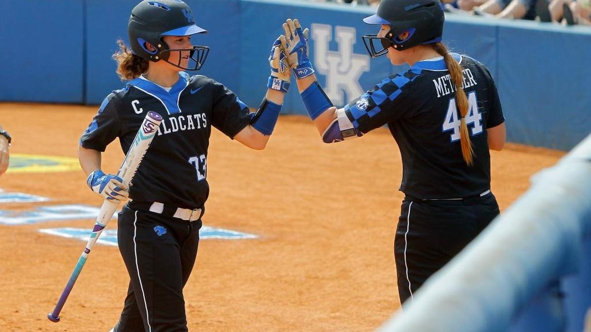 UK's Katie Reed, left, high-fived with Rachael Metzger after scoring in the first inning against No. 3 Florida at John Cropp Stadium in Lexington, Ky., Saturday, April 15, 2017. Reed has been named first-team All-SEC this season.