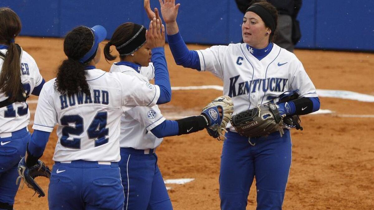 UK pitcher Kelsey Nunley slaps hands with Kara Howard, left, after holding LSU scoreless after two innings in their SEC home opener at John Cropp Stadium in Lexington, Ky., Friday, March 27, 2015.