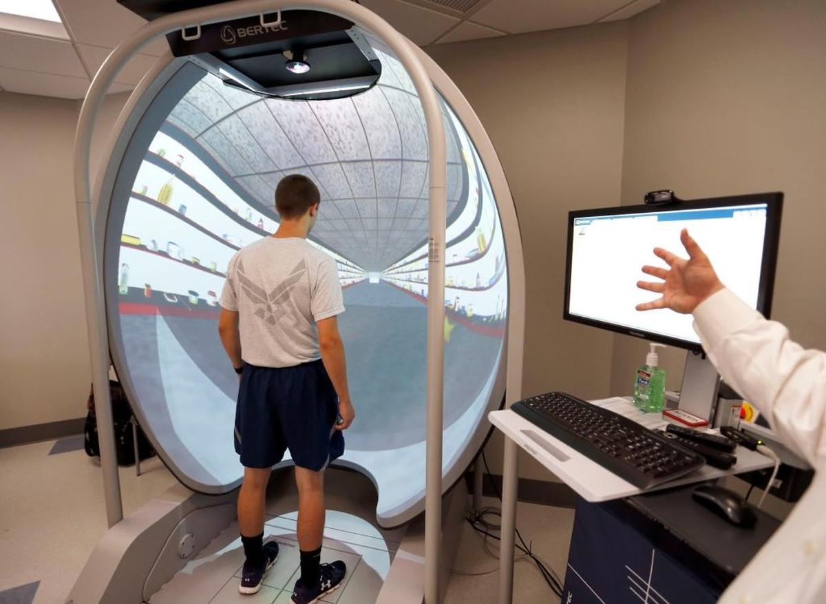 Jonah Bibb, a UK Air Force ROTC cadet, demonstrated Computerized Dynamic Posturography that measures human balance control in the University of Kentucky’s new Sports Medicine Research Institute on Wednesday.
