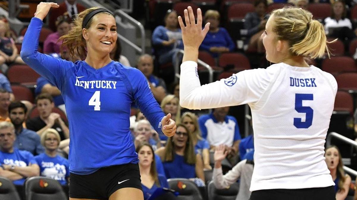 Kentucky's Anni Thomasson, left, and libero Ashley Dusek celebrated a point against Louisville. The Wildcats topped the host Cardinals 25-15, 25-18 and 25-9.