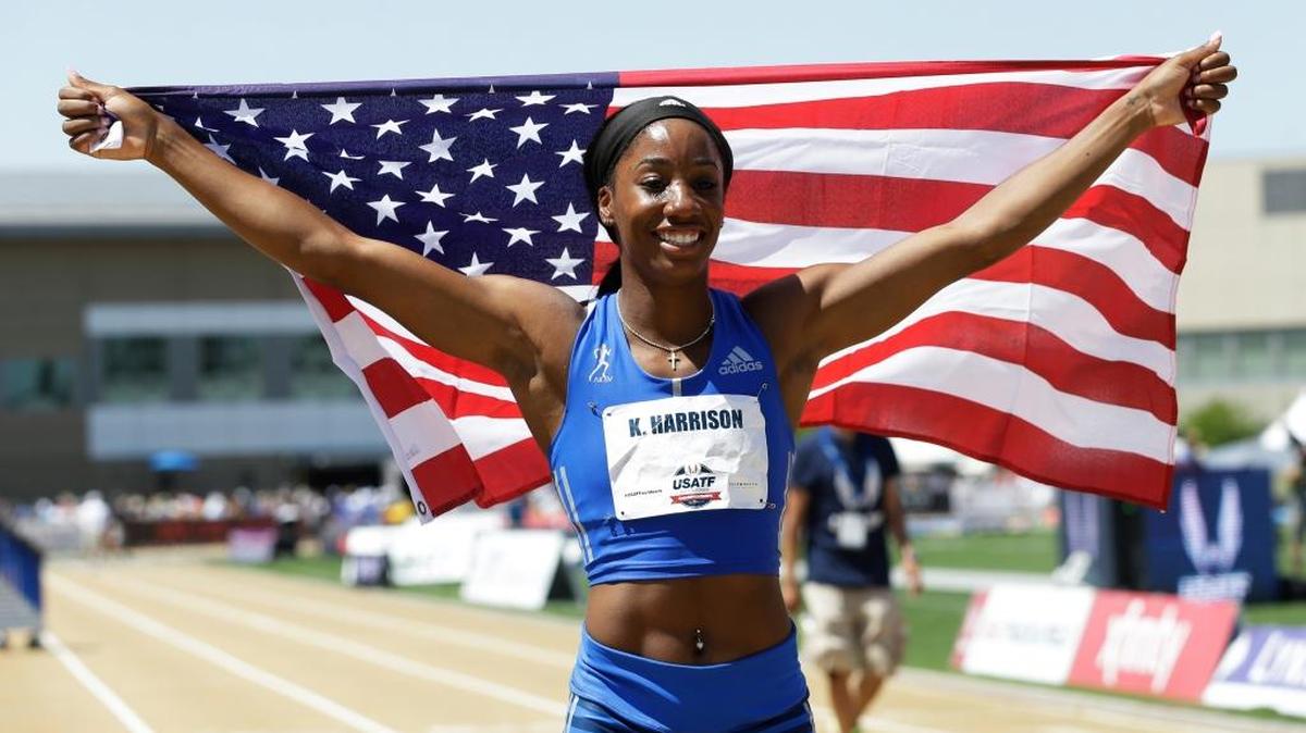 Kendra Harrison holds a U.S. flag after she won the women's 100 hurdles at the U.S. Track and Field Championships, Saturday, June 24, 2017, in Sacramento, Calif. (AP Photo/Rich Pedroncelli)