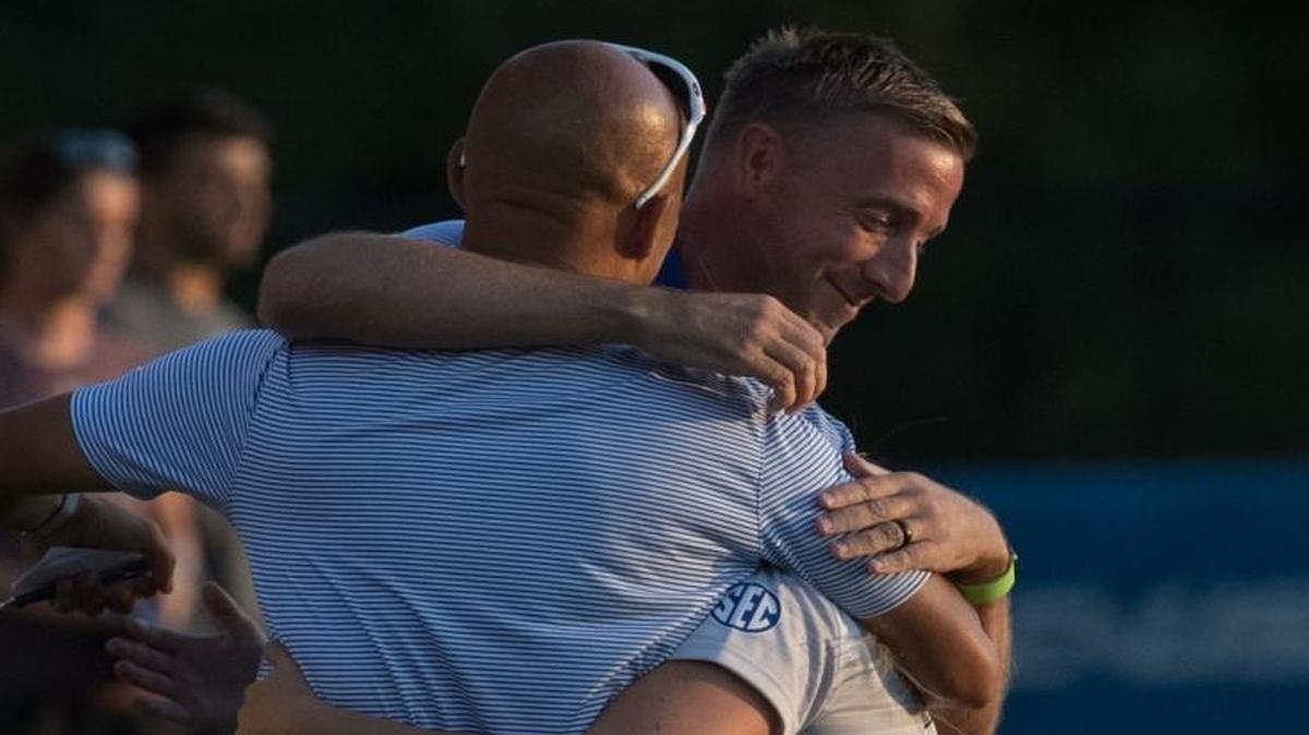Kentucky head coach Ian Carry, and assistant coach Jason Goodson hugged Foster Ignoffo (2) after she scored the first goal of the game as UK women soccer team hosted EKU in its opener at the Wendell & Vickie Bell Soccer Complex on Thursday Aug. 24, 2017 in Lexington, Ky.