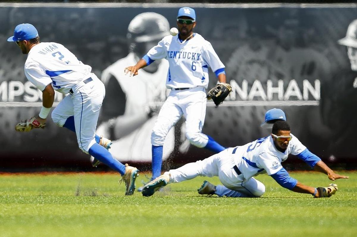 Kentucky's Riley Mahan (2) Tristan Pompey (6) and Marcus Carson (15) fail to catch a fly ball in the eighth inning during an NCAA baseball super regional against Louisville at Jim Patterson Stadium in Louisville, Ky., Saturday, June 10, 2017. Louisville beat Kentucky 6-2.