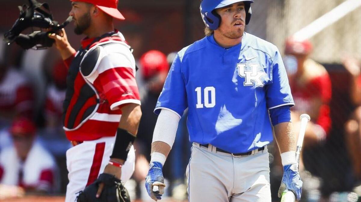 Kentucky's Luke Becker (10) returns to the dugout after striking out in the seventh inning during an NCAA baseball super regional against Louisville at Jim Patterson Stadium in Louisville on Friday, June 9, 2017. Louisville beat Kentucky 5-2.