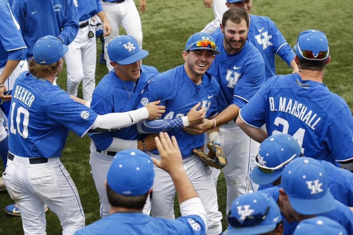 Kentucky outfielder Zach Reks (40) celebrates with teammates following a triple play in the second inning against the Louisville Cardinals at Cliff Hagan Stadium in Lexington, Ky., Tuesday, April 18, 2017.