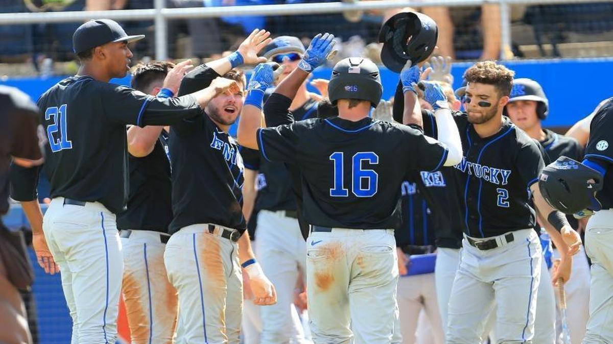 Kentucky’s Troy Squires (16) was congratulated after he came home on Marcus Carson’s eighth-inning home run. Florida defeated Kentucky 6-4 in the regular-season finale for both teams.