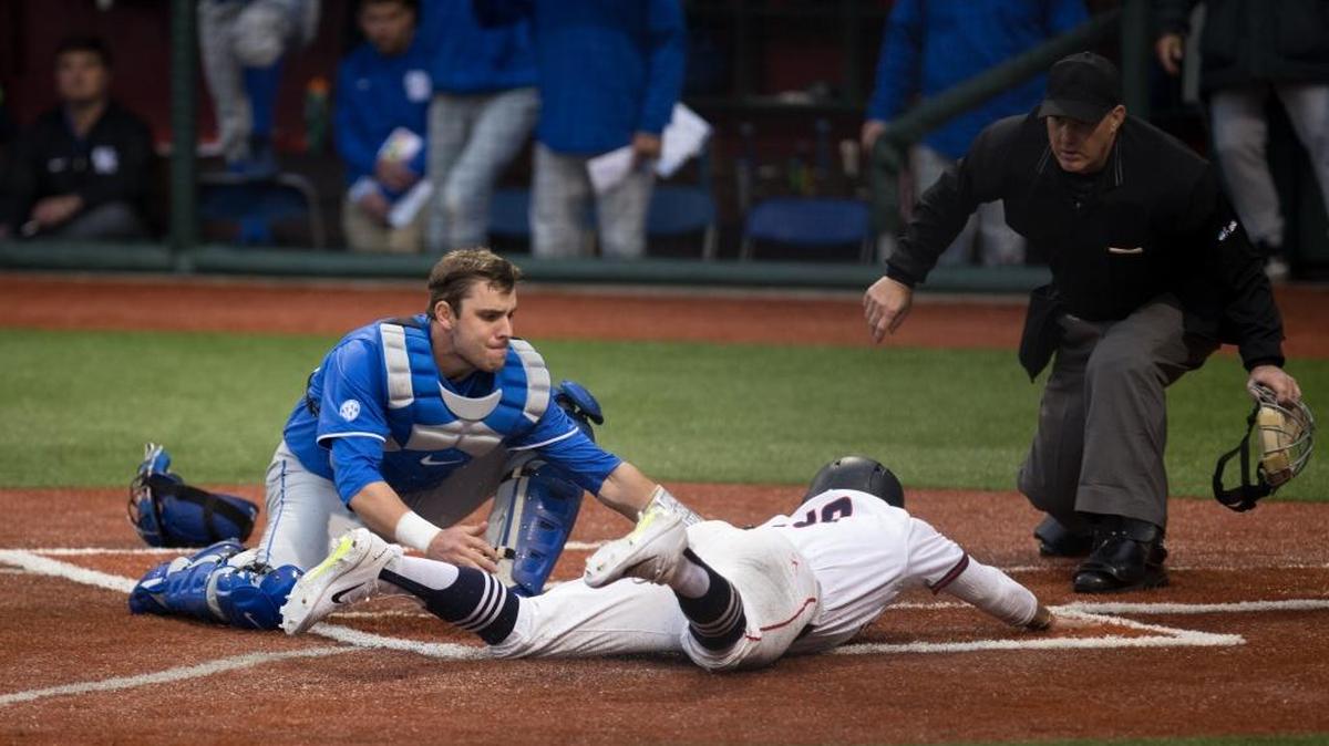 Kentucky catcher Troy Squires tagged out Liberty’s Cam Locklear, who was trying to score from third on a bunt fielded by pitcher Colton Cleary.