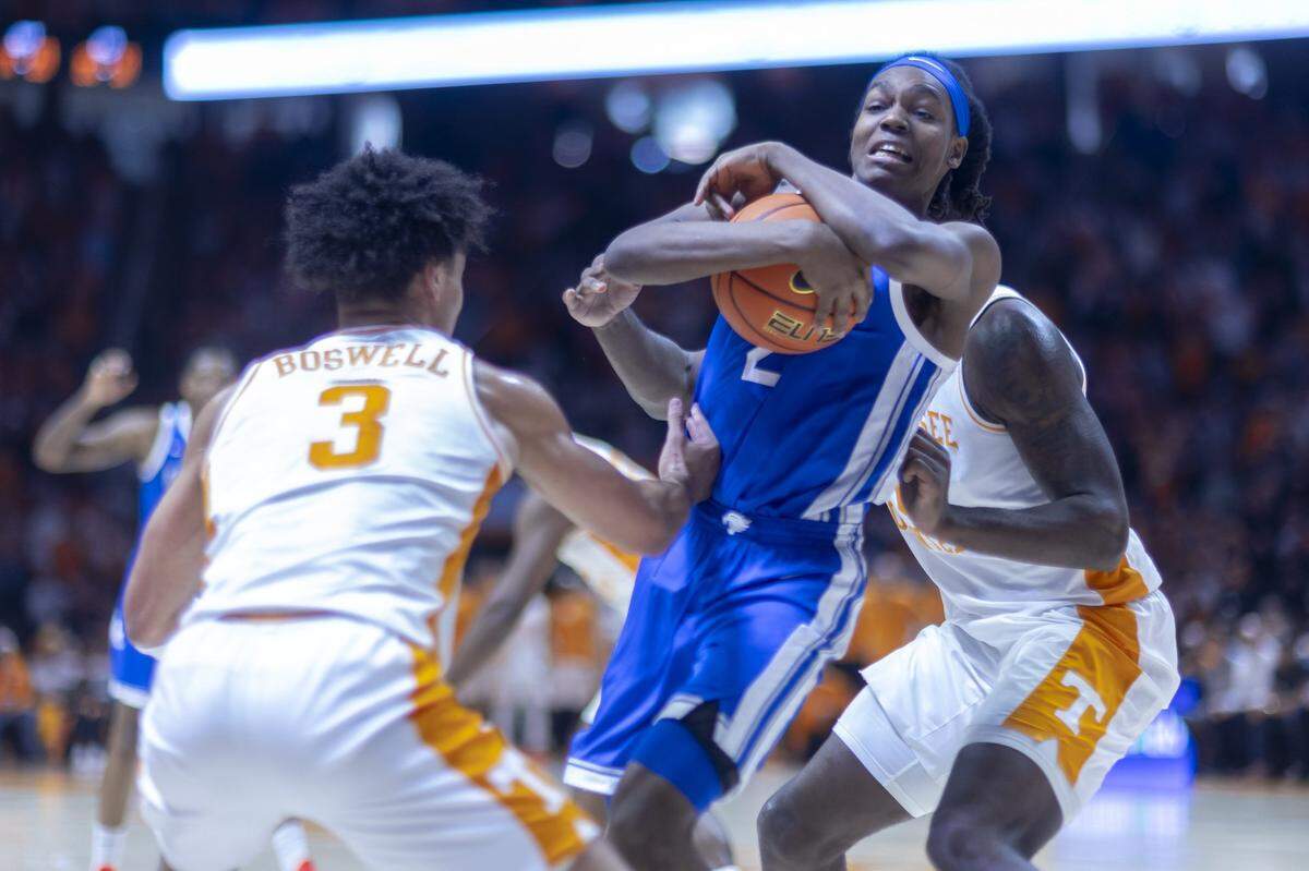 Kentucky guard Jasper Johnson protected the ball from two Tennessee defenders during the Wildcats’ 80-78 victory over the Volunteers last weekend. Johnson had 12 points and four assists in the game, and his ability to hold on to the ball on this play was mentioned by Mark Pope as a key moment in the victory.