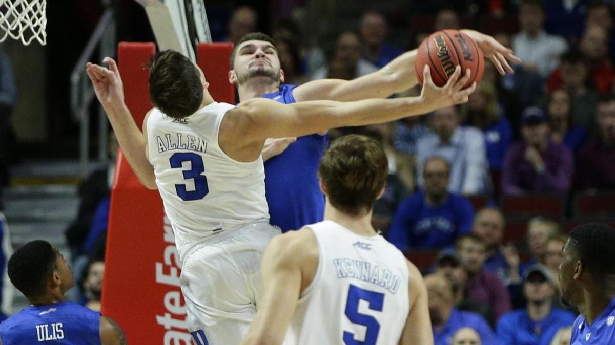 Kentucky's Isaac Humphries (15) blocks the shot of Duke's Grayson Allen (3) during the Champions Classic at the United Center in Chicago on Tuesday, Nov. 17, 2015. Kentucky won, 74-63.