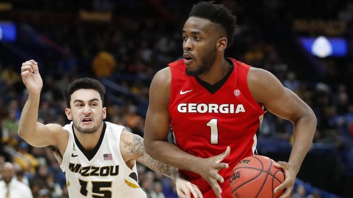 Georgia’s Yante Maten (1) drove to the basket past Missouri’s Jordan Geist (15) during their SEC Tournament game in St. Louis on Thursday. Maten led Georgia with 21 points and 10 rebounds in a 62-60 second-round win.