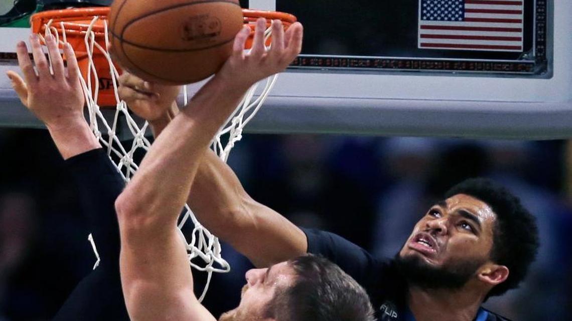 Timberwolves center Karl-Anthony Towns (32) knocked the ball away from Boston Celtics center Tyler Zeller (44) on a rebound during the second half in Boston on Monday, Dec. 21, 2015. Boston won 113-99.