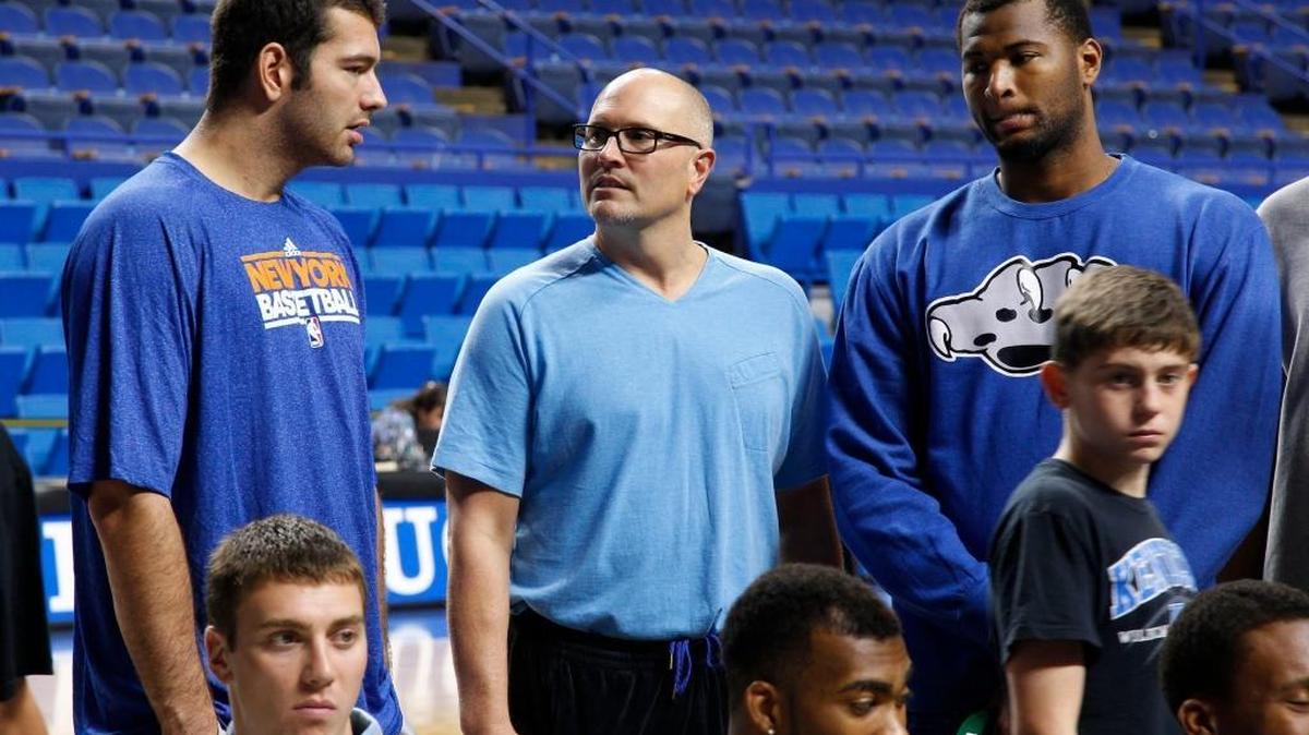 Former UK players Josh Harrellson, left, Rex Chapman, and DeMarcus Cousins talked a UK all-stars photo session on 2011.