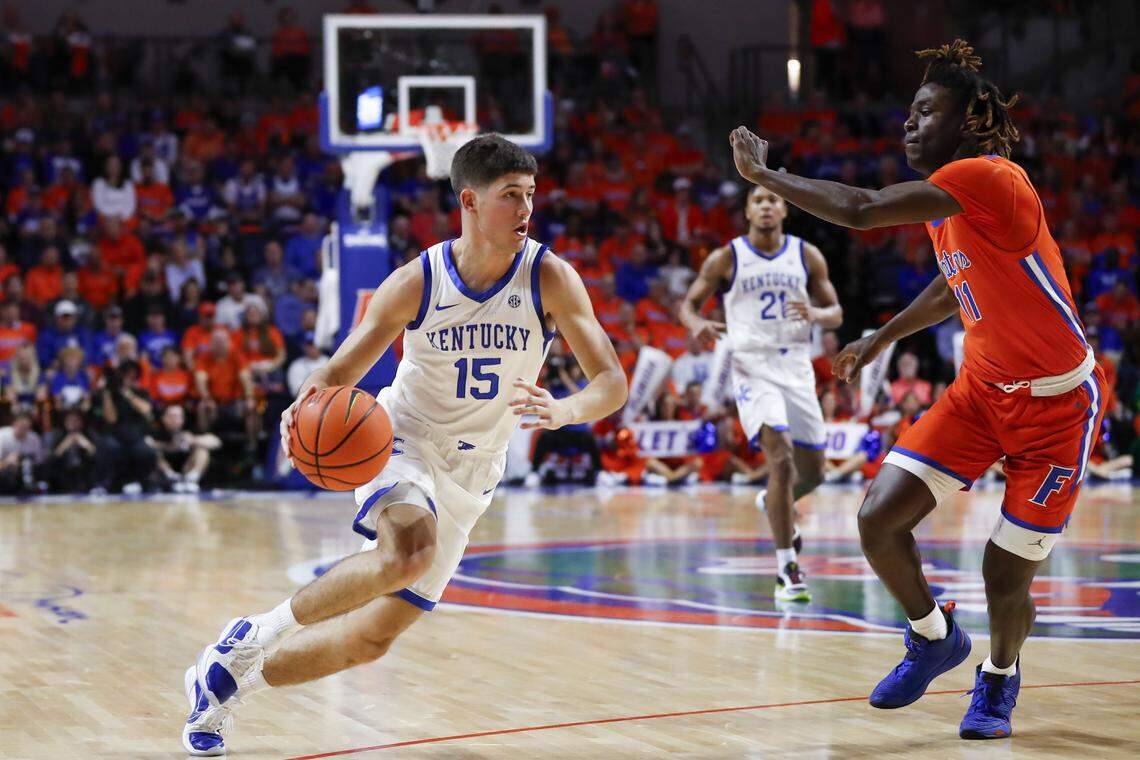Kentucky guard Reed Sheppard looks to drive past Florida guard Denzel Aberdeen during a game in Gainesville on Jan. 6, 2024.