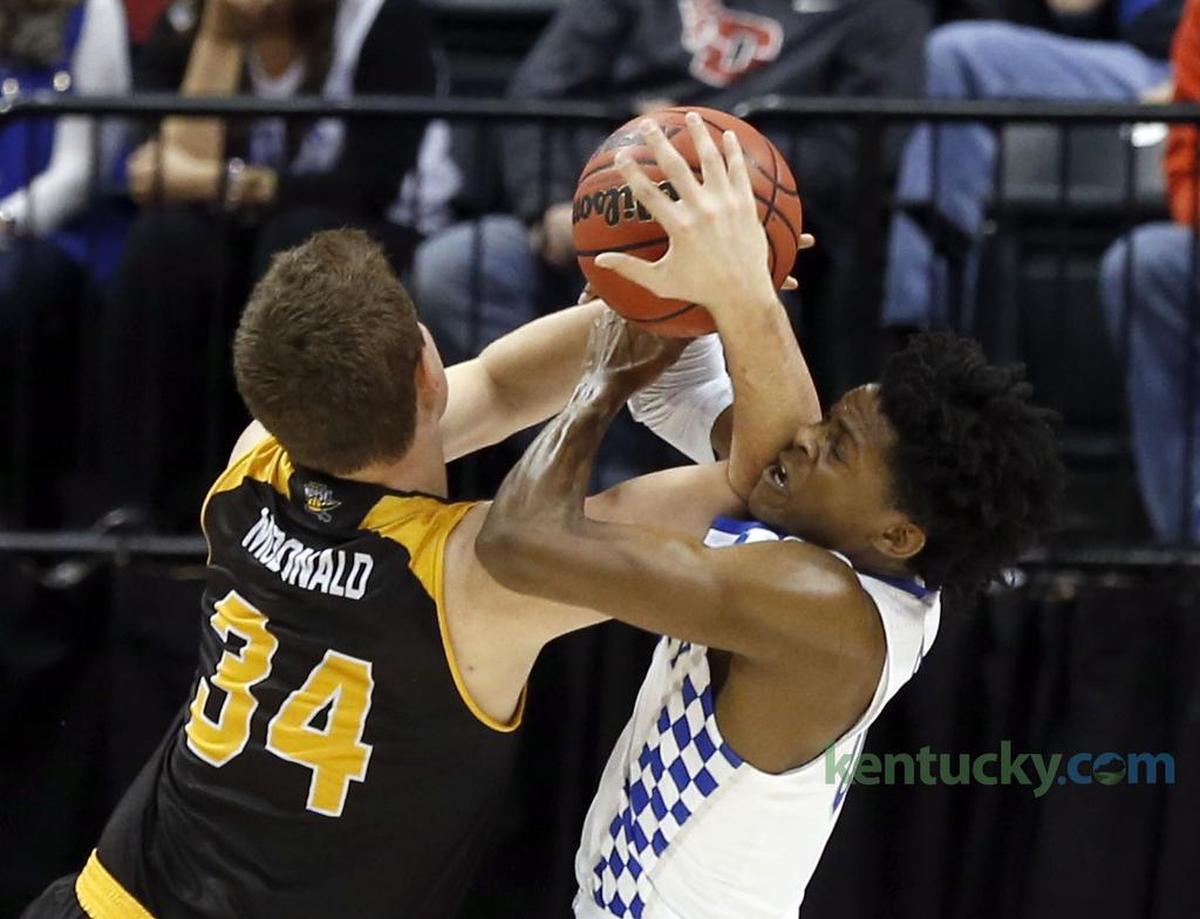 Northern Kentucky forward Drew McDonald, No. 34, battled for the ball with Kentucky guard De'Aaron Fox during UK's 79-70 victory over NKU in the 2017 NCAA Tournament round of 64.
