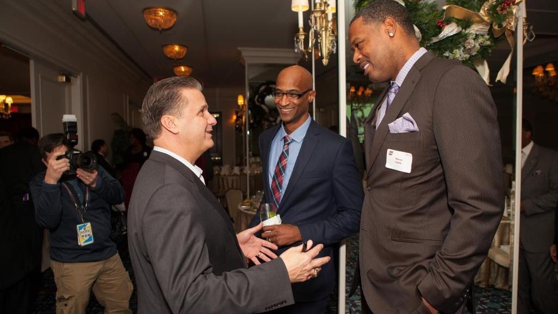 John Calipari with former Minutemen Rigo Nunez, left, and Marcus Camby.