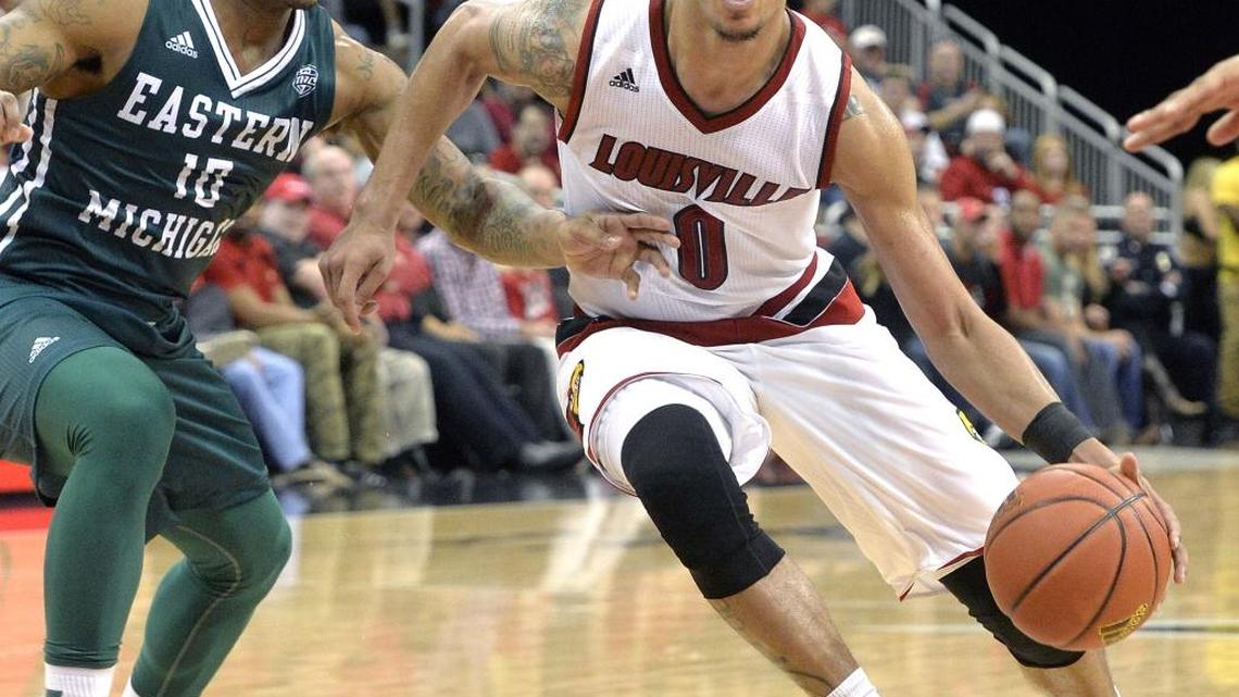 Louisville's Damion Lee (0) drives past the defense of Eastern Michigan's Willie Mangum IV (10) during the second half of an NCAA college basketball game, Saturday, Dec. 12, 2015, in Louisville, Ky. Louisville won 86-53.