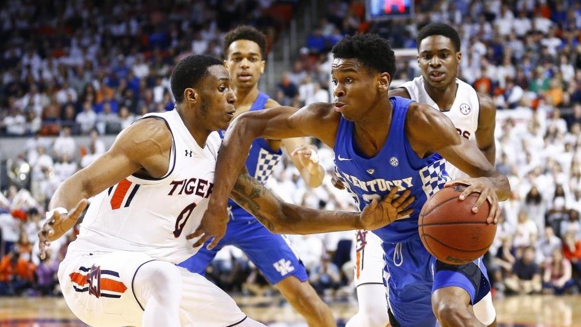 Kentucky guard Shai Gilgeous-Alexander, right, dribbled past Auburn forward Horace Spencer during their game Wednesday in Auburn Arena. The Tigers won 76-66.