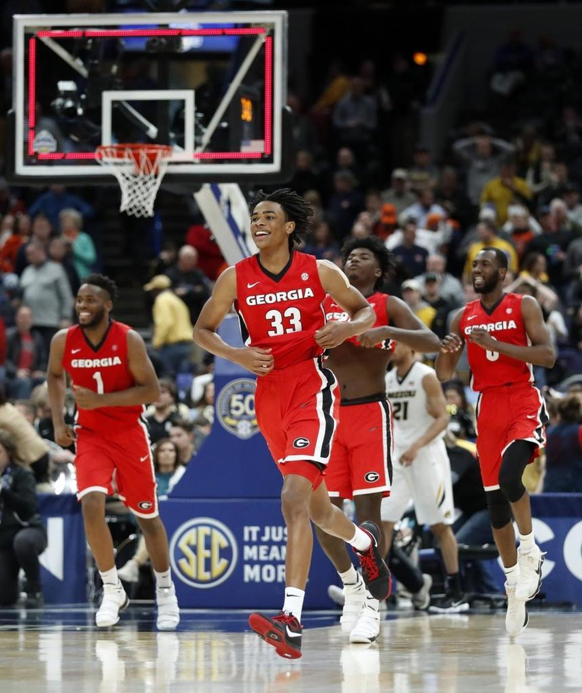 Georgia’s Nicolas Claxton (33) and his teammates ran off the court in celebration after knocking No. 5 seed Missouri out of the SEC Tournament in St. Louis on Thursday. Georgia, the tournament’s No. 12 seed, will take on No. 4 seed Kentucky in Friday’s quarterfinals.
