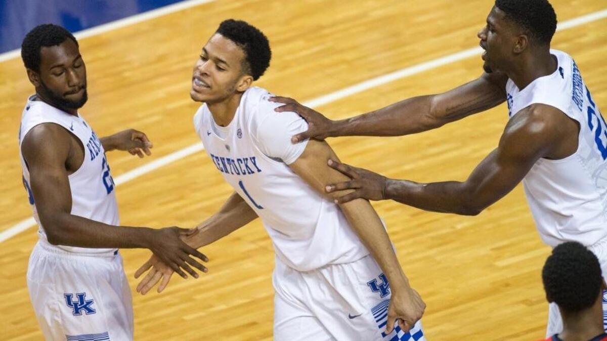 Kentucky’s Skal Labissiere, center, celebrated with Dominique Hawkins, left, and Alex Poythress during the team’s 83-61 victory against Mississippi in Rupp Arena on Jan. 2.