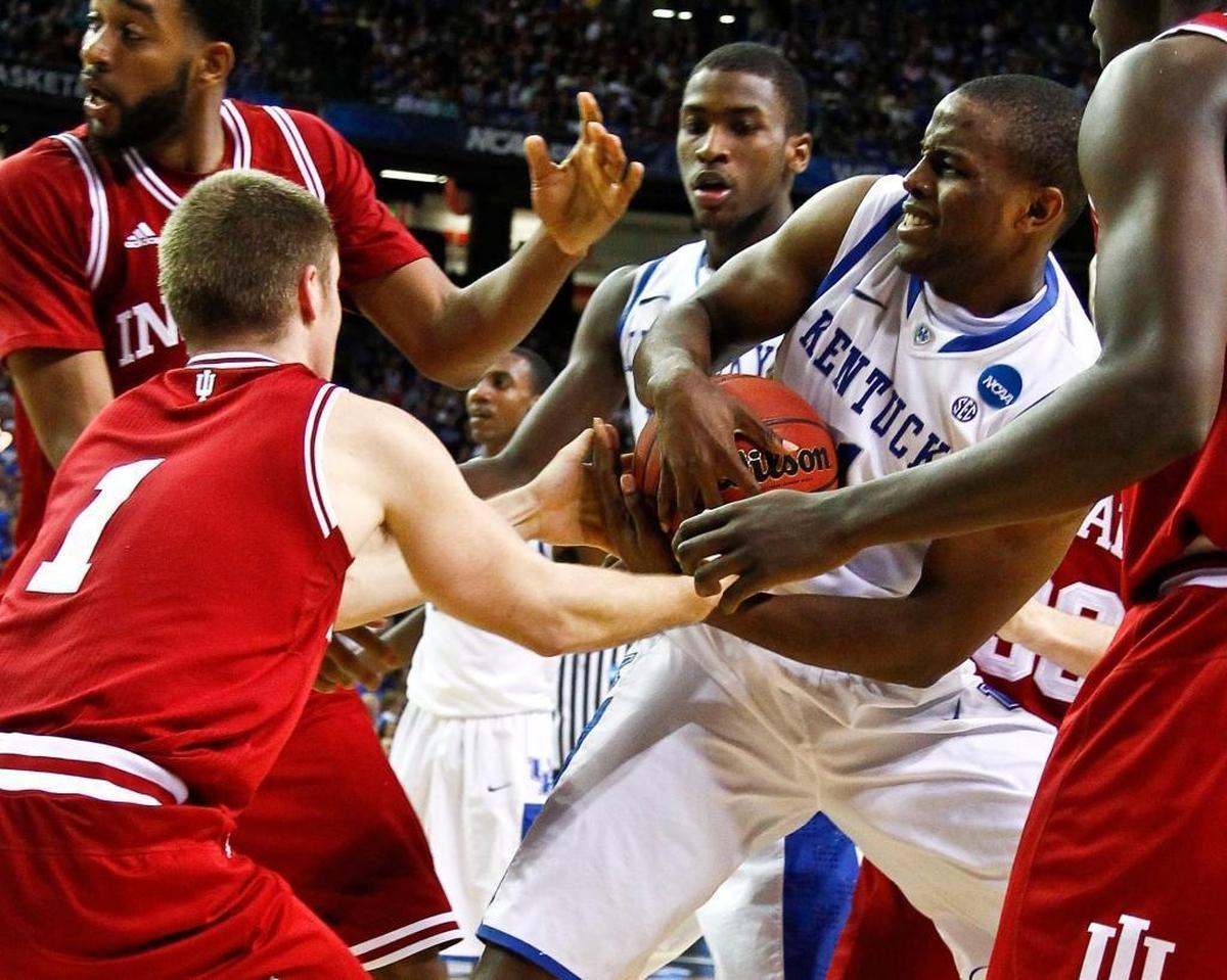 Kentucky guard Darius Miller (1) pulled the ball away from Indiana’s Jordan Hulls (1) as No. 1 Kentucky defeated Indiana 102-90 in the NCAA Sweet 16 in Atlanta in 2012.