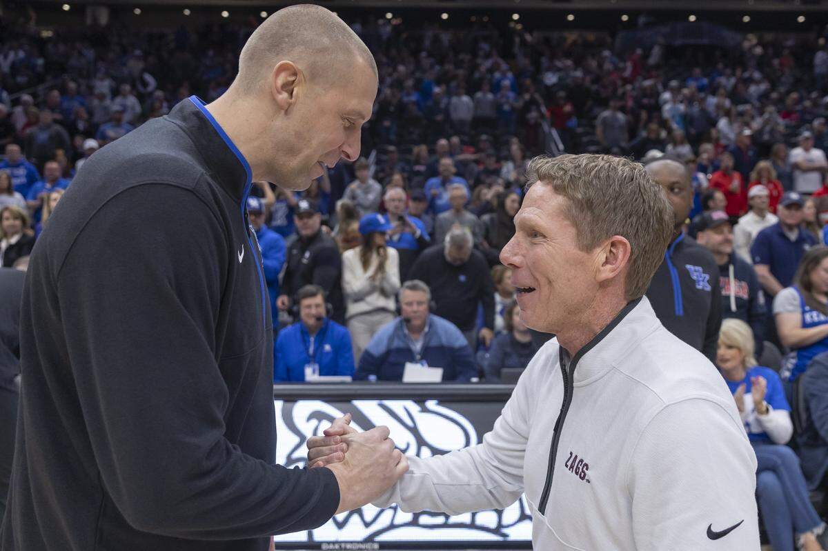 Kentucky Wildcats head coach Mark Pope greets Gonzaga Bulldogs head coach Mark Few before the Battle in Seattle at Climate Pledge Arena in Seattle on Saturday, Dec. 7, 2024.  