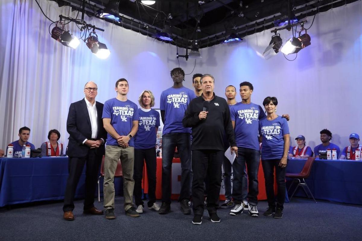 UK head basketball coach John Calipari and the UK men’s basketball team, shown with booster Joe Craft and Ambassador Kelly Craft, up to raise funds for Hurricane Harvey relief during the Teaming Up For Texas telethon to benefit the American Red Cross at the WKYT studios in Lexington, Ky., Sunday, Sept. 3, 2017.